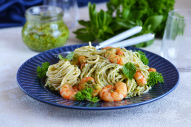 Pasta with pesto sauce and shrimp