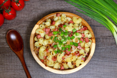 Pasta with sausage in a frying pan