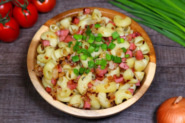 Pasta with sausage in a frying pan