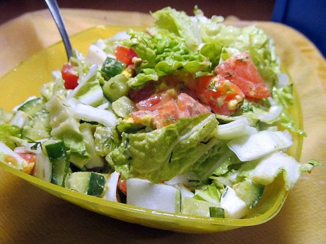 Salad with salted salmon, cucumber and tomatoes