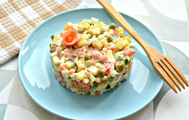 Olivier salad with salmon and cucumber