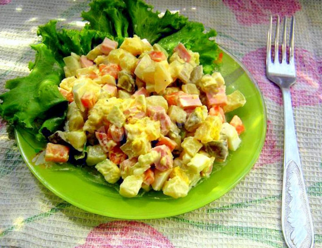 Classic winter olivier salad with sausage and apple