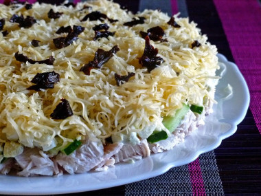 Ladies' caprice salad with chicken and prunes