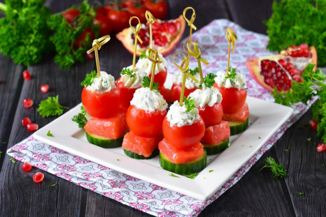 Canapé with red fish on skewers with cottage cheese