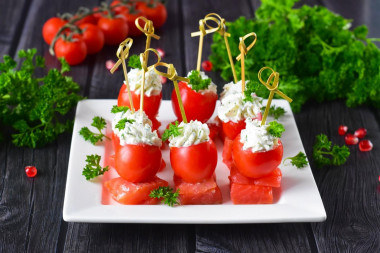Canapé with red fish on skewers with cottage cheese