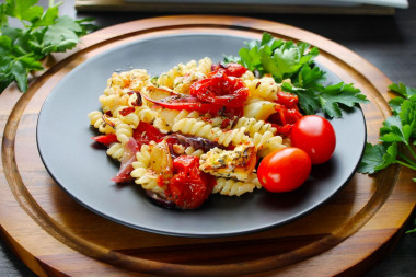 Pasta with vegetables and cheese in the oven