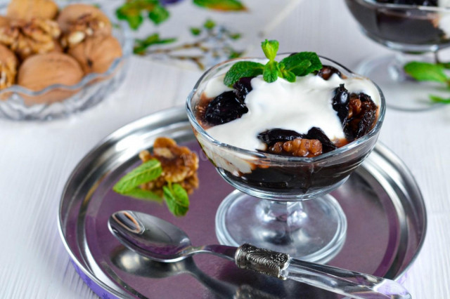 Dessert with prunes and walnuts with sour cream