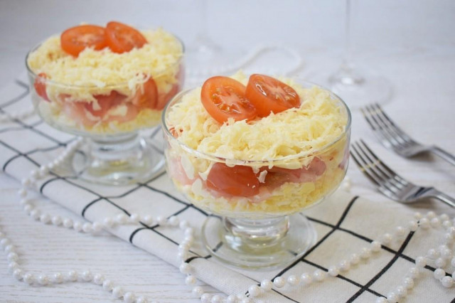 Salad with cheese, egg and shrimp in creamers