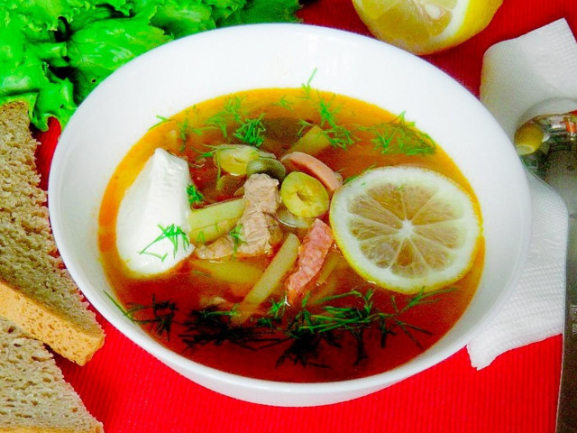 Soup solyanka with pork and sausages