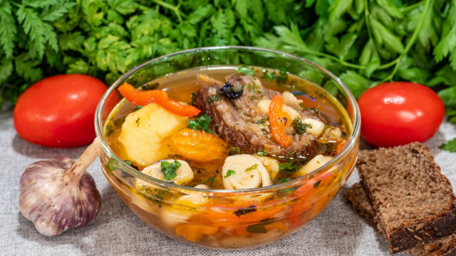 Beef meat soup with dumplings and vegetables