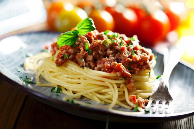 Pasta bolognese with onion and tomato sauce