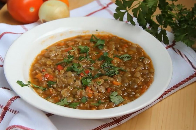 Green lentil soup with vegetables and a mixture of herbs