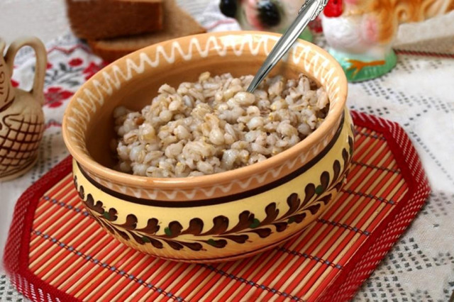Pearl barley porridge on water with butter