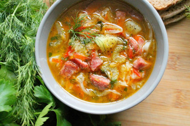 Young cabbage soup with smoked sausage