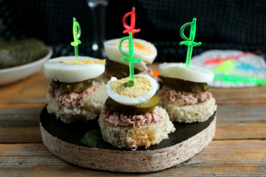 Canapes with canned tuna and pickled cucumbers