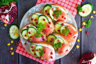 Sandwiches with red fish and cucumber