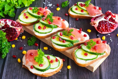 Sandwiches with red fish and cucumber