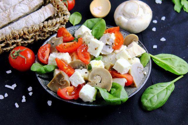 Salad with chicken mushrooms tomatoes and cheese