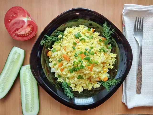 Rice with carrots and onions in a slow cooker