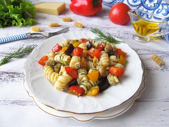 Pasta with baked vegetables and cheese in the oven