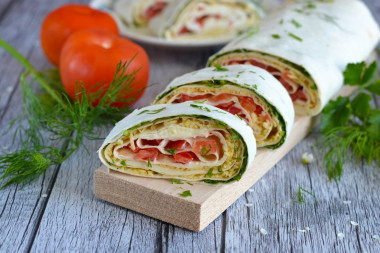 Pita bread roll with tomatoes and cheese