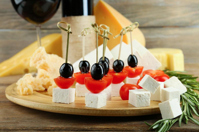Canapes with olives and cheese