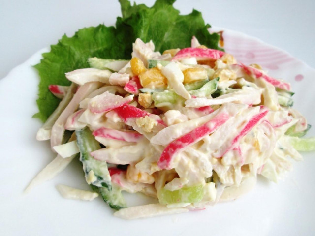 Salad with squid and crab sticks and cucumber
