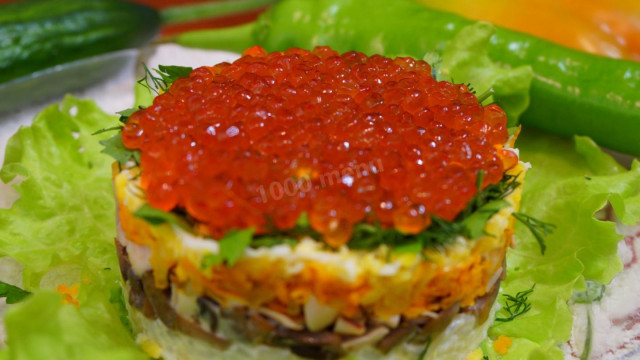 Salad with squid and red caviar