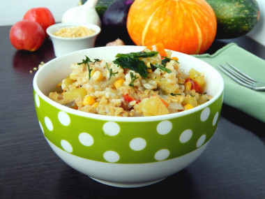 Bulgur with vegetables on the stove