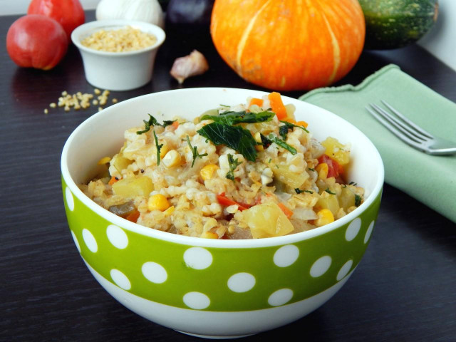 Bulgur with vegetables on the stove