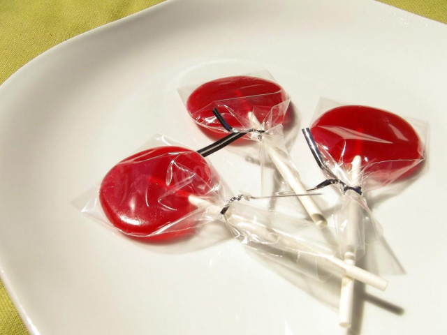 Lollipops on a stick of corn syrup