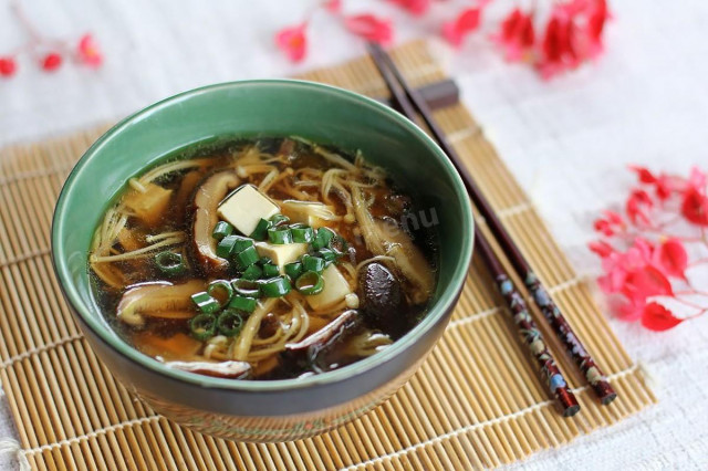 Mushroom broth soup with cheese and noodles