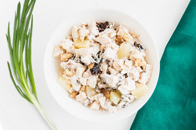 Chicken salad with pineapples and prunes and walnuts