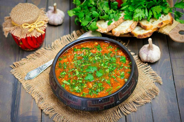 Classic chicken kharcho soup with tomato paste and coriander