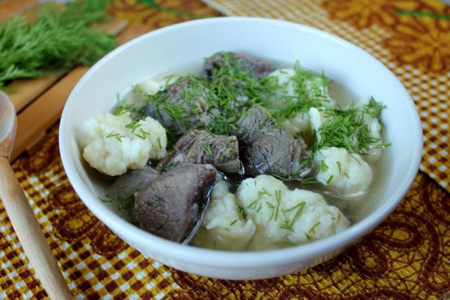 Soup with dumplings with meat