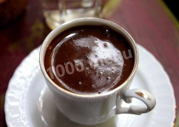 Coffee in a turk with foam
