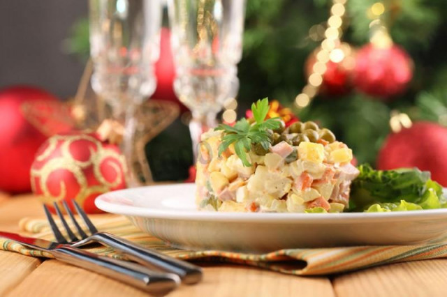 Olivier salad with canned sausage and peas