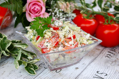 Salad of young cabbage with tomatoes and cottage cheese.