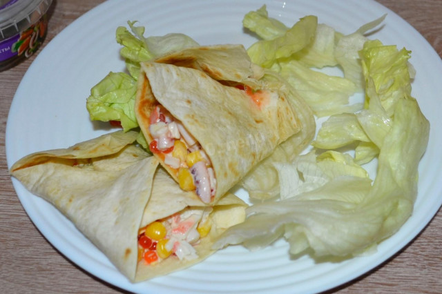 Appetizer of crab sticks and squid in a tortilla