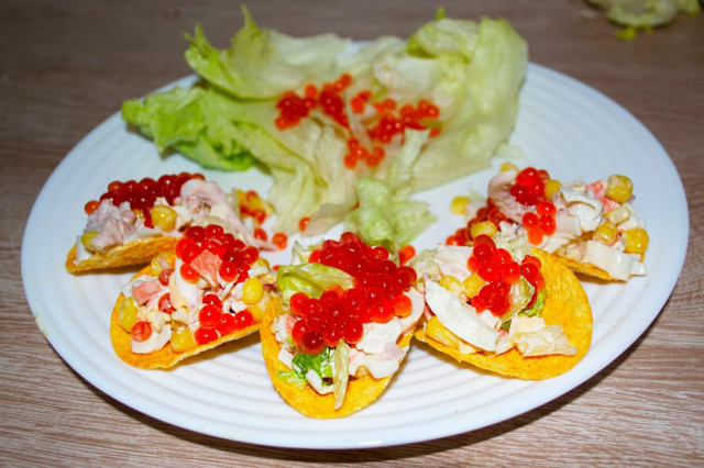 New Year's snack of crab sticks and squid on chips