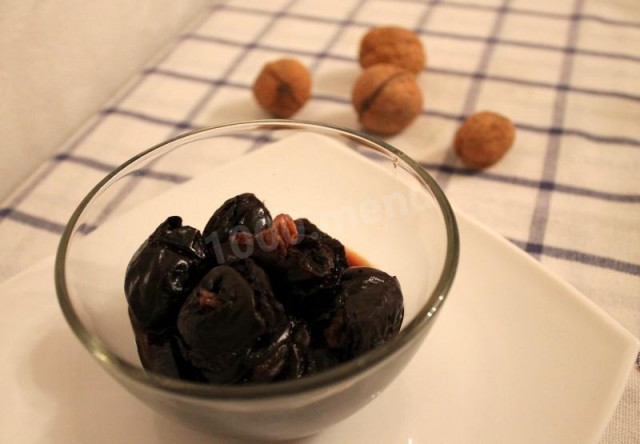 Prunes with nuts in wine