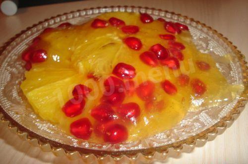 Oranges with pomegranate under thick juice