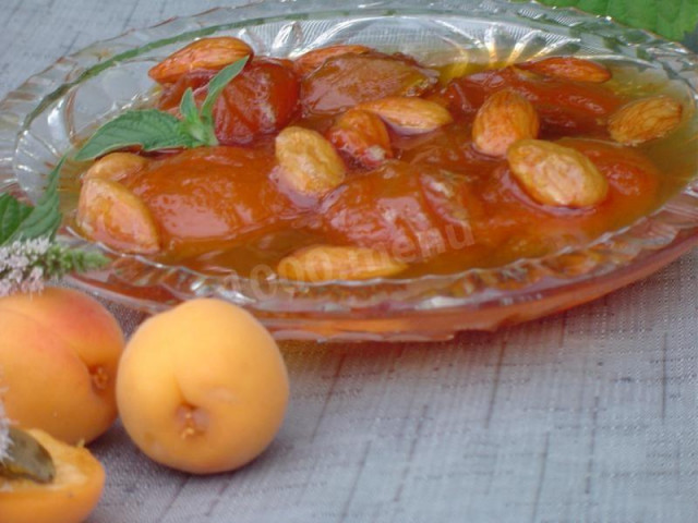 Pitted apricot jam with almonds in water