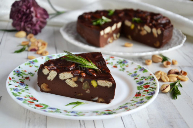 Chocolate cake on gelatin with cookies and nuts