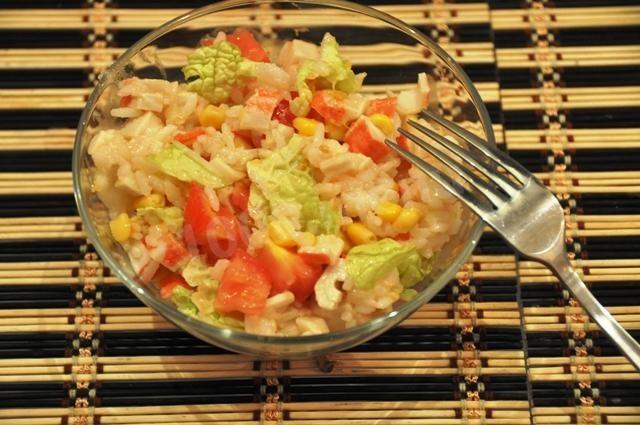Crab sticks salad with rice and corn and tomatoes