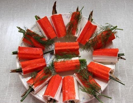 Crab sticks stuffed with egg and sprats