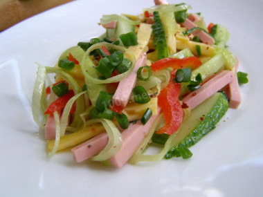 Salad with boiled sausage, hard cheese and fresh cucumber