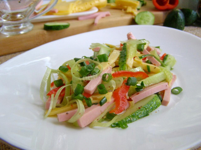 Salad with boiled sausage, hard cheese and fresh cucumber