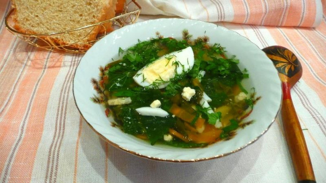 Potato soup on water with nettle sorrel boiled egg