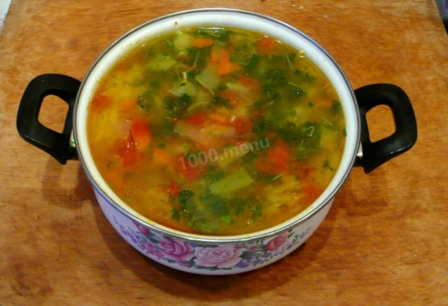 Peasant soup with tomatoes, cabbage, potatoes